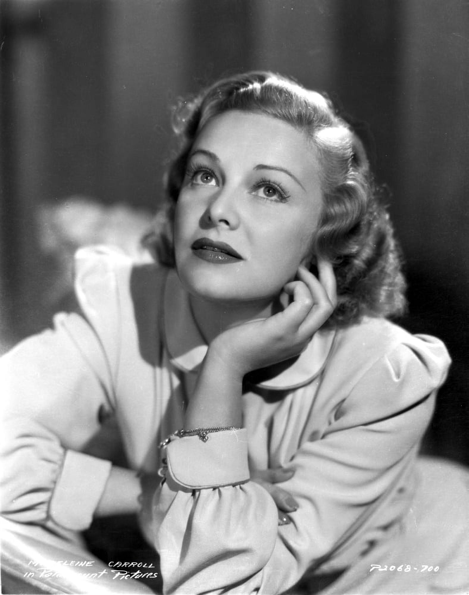 Madeleine Carroll Looking up in White Dress with Head Leaning on Hand