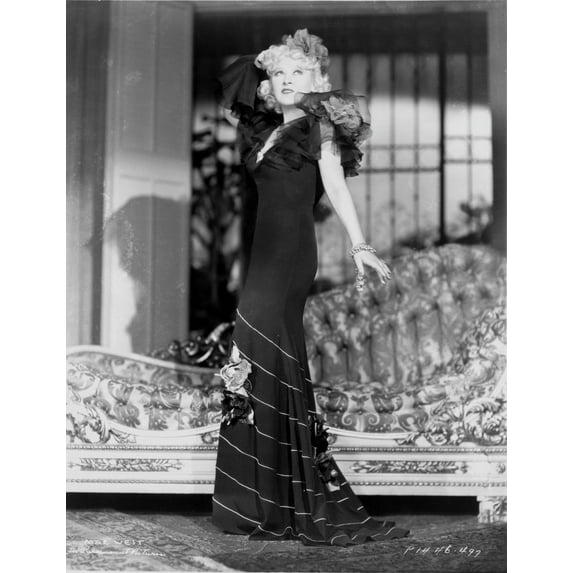 Mae West standing in Black Dress with Floral Sleeves Photo Print (24 x 30)