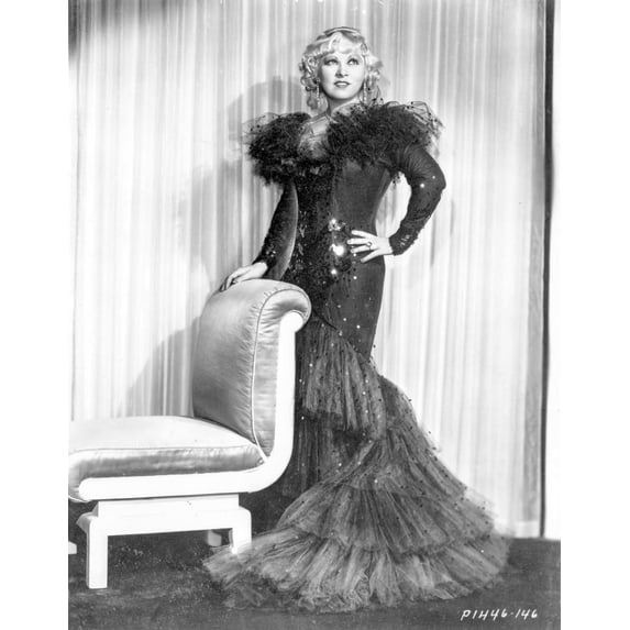 Mae West standing in Black Long Gown with One Hand on Hips Photo Print (8 x 10)