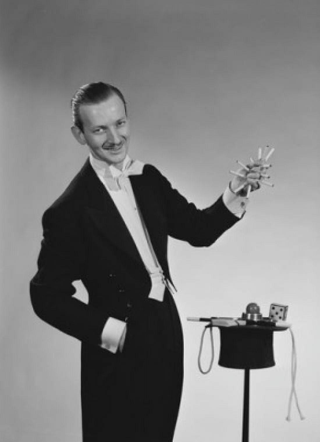 Magician pulling cigarettes out of hat Canvas Art - (24 x 36)