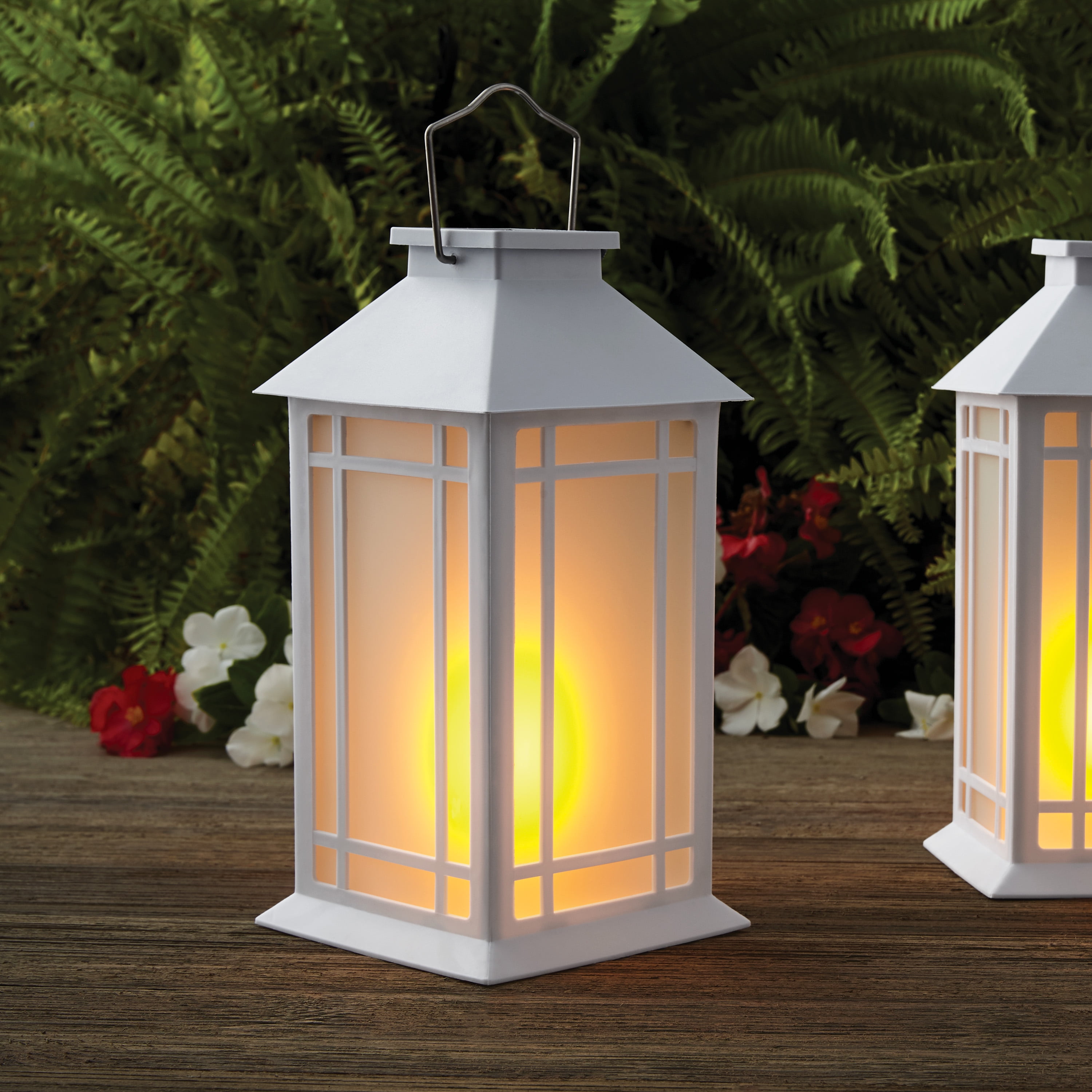 https://i5.walmartimages.com/seo/Mainstays-White-Plastic-Solar-Powered-Lantern-With-Flickering-Flame-LED-Light_da15c503-ebde-49b0-8517-60e3a9d240c7.c39ed39cc6a2f29f061aef1bc5a4c3d6.jpeg