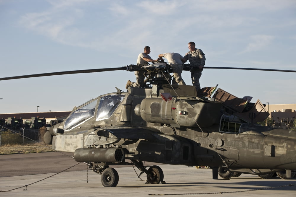 Maintenance crew work on the mast of an AH-64D Apache Longbow Canvas Art - Terry MooreStocktrek Images (18 x 12)