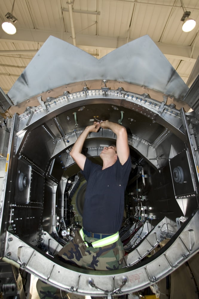 Maintenance crew works on an F-22 Raptor Canvas Art - HIGH-G ProductionsStocktrek Images (12 x 18)