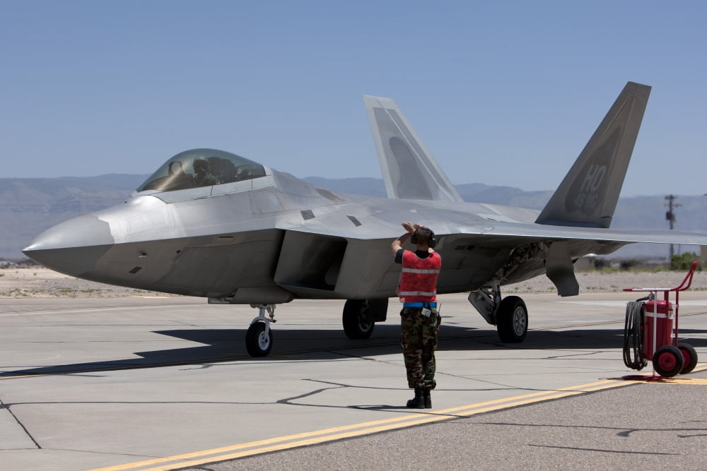 Maintenance crews perform preflight checks with F-22 Raptors Canvas Art - HIGH-G ProductionsStocktrek Images (18 x 12)