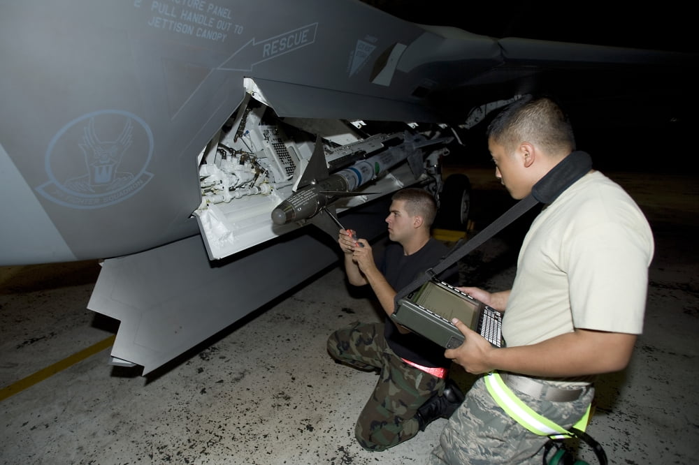 Maintence crew works on an F-22 Raptor Canvas Art - HIGH-G ProductionsStocktrek Images (36 x 24)