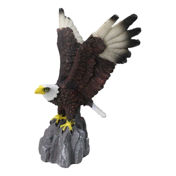 Majestic Soaring Bald Eagle Figurine with Outstretched Wings on Rocky Cliff
