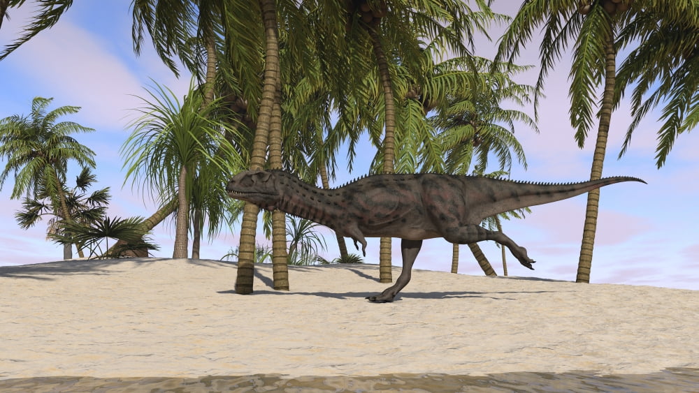 Majungasaurus running across a tropical landscape Canvas Art - Kostyantyn IvanyshenStocktrek Images (38 x 22)