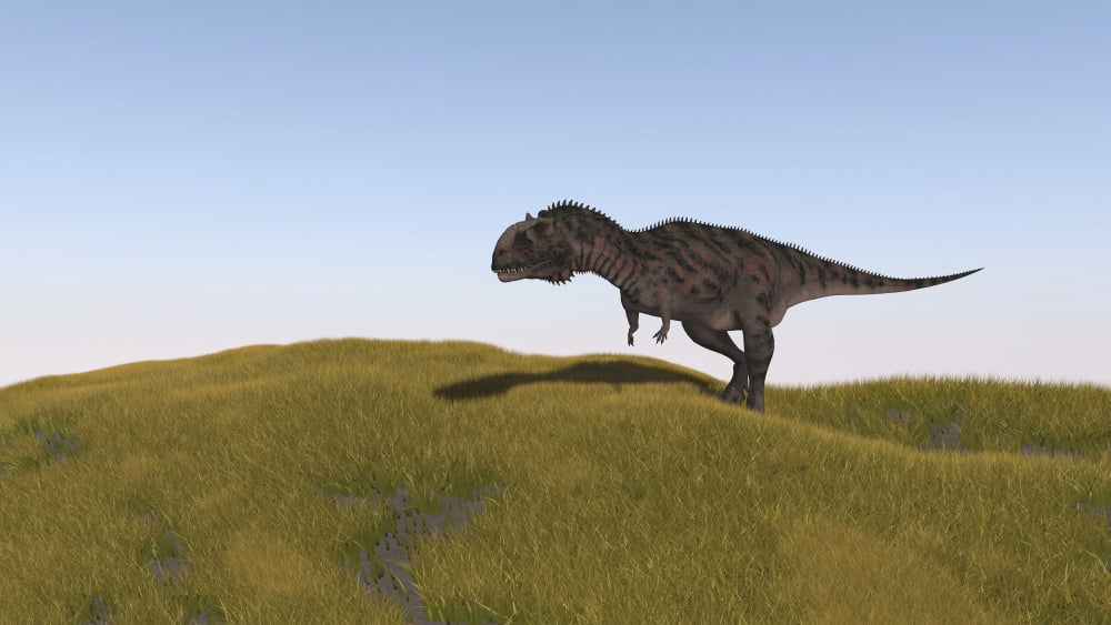 Majungasaurus walking across a grassy field Canvas Art - Kostyantyn IvanyshenStocktrek Images (38 x 22)