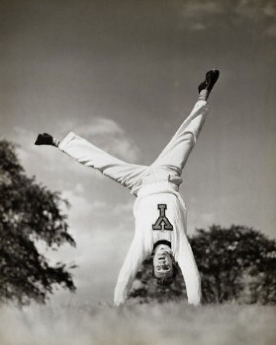 Male cheerleader doing a cartwheel Canvas Art - (18 x 24)