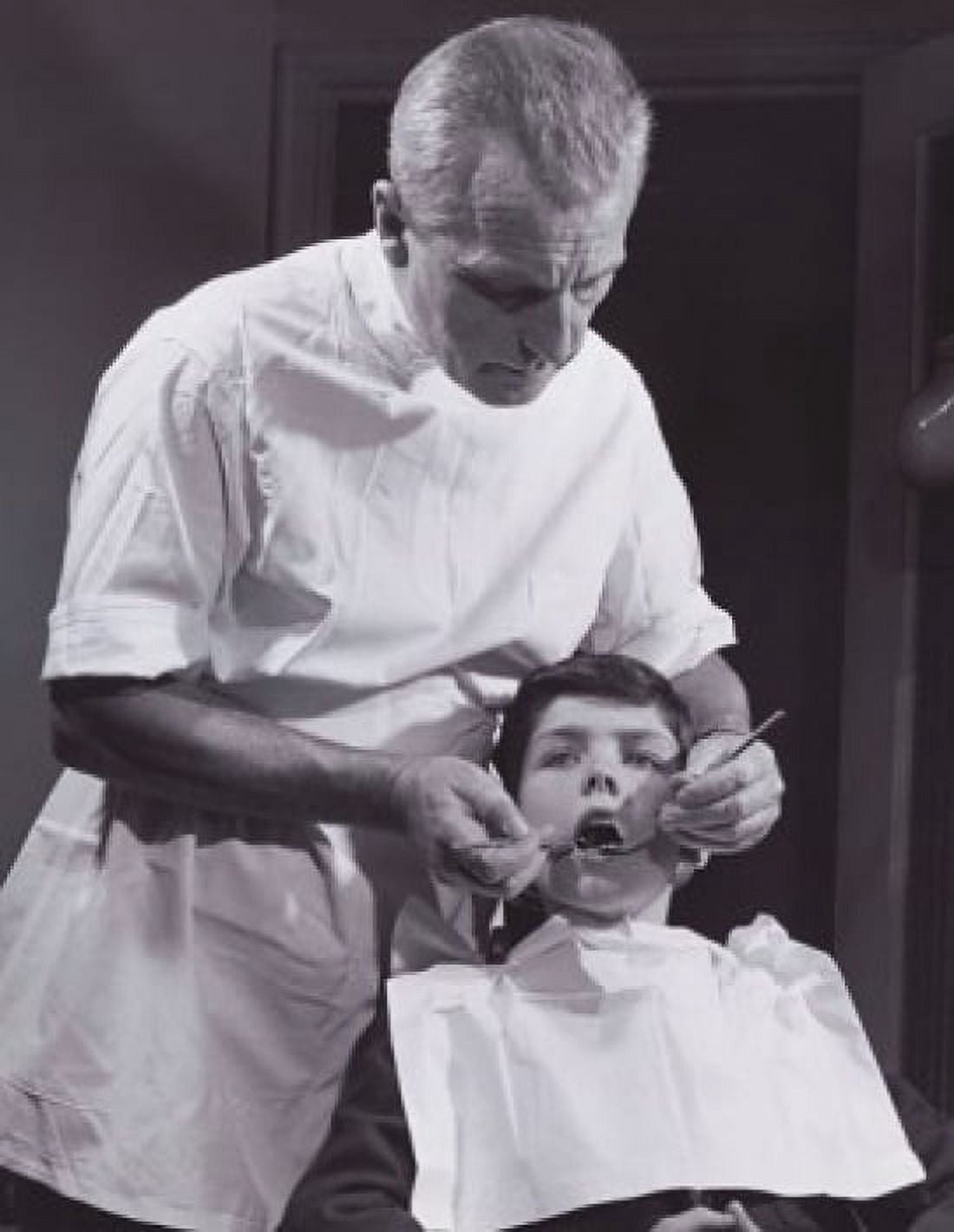 Male dentist examining a boys teeth Canvas Art - (24 x 36)