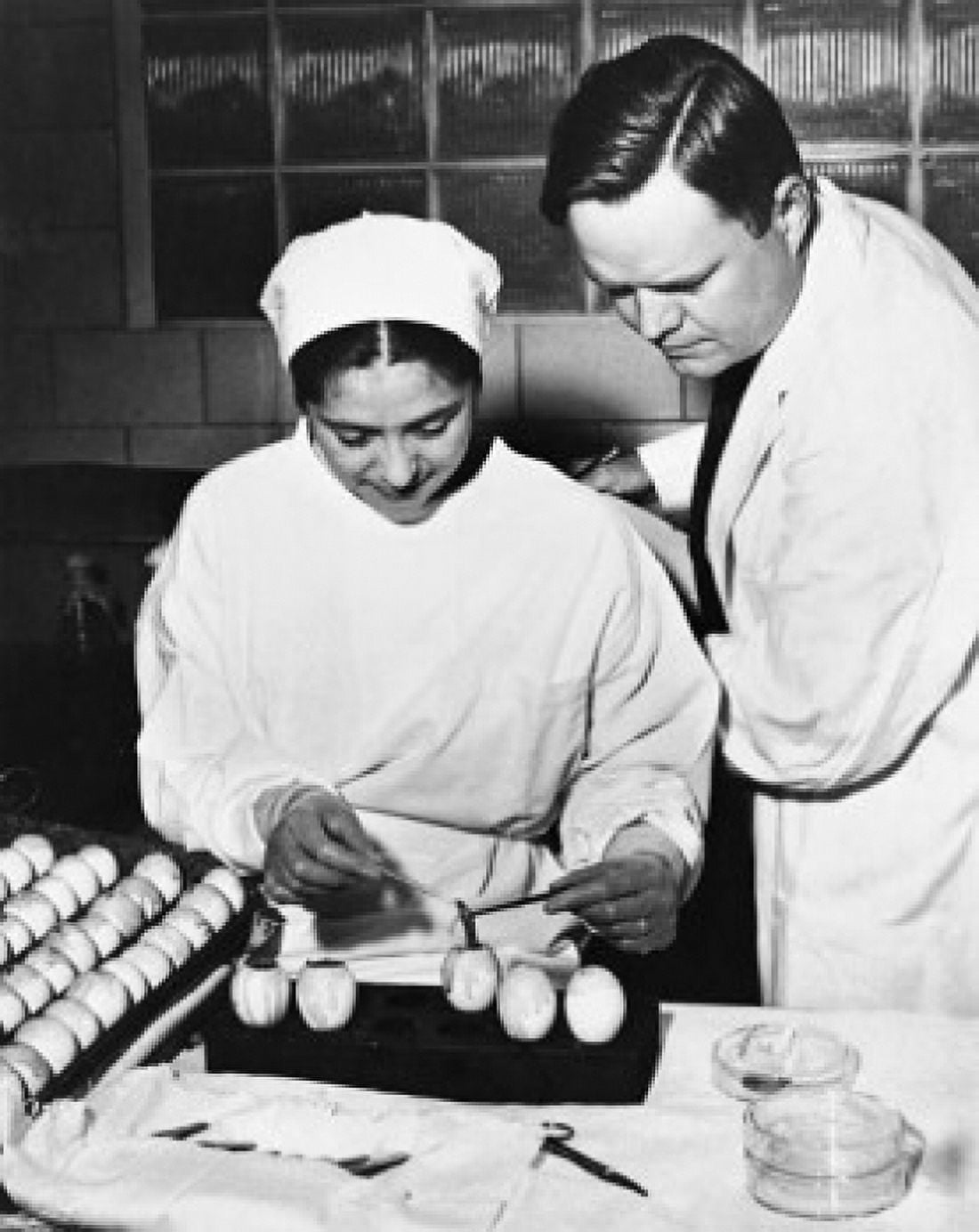 Male doctor and a female nurse preparing the flu vaccine Canvas Art - (18 x 24)