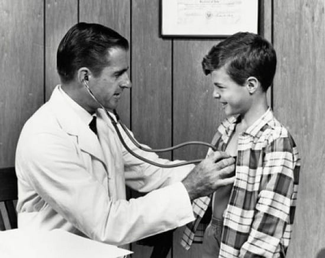 Male doctor examining a boy with a stethoscope Canvas Art - (18 x 24)