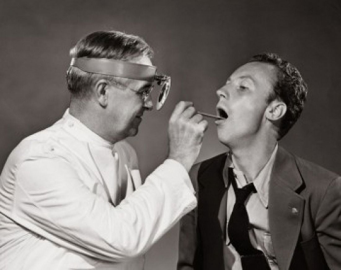 Male doctor examining a patient Canvas Art - (18 x 24)