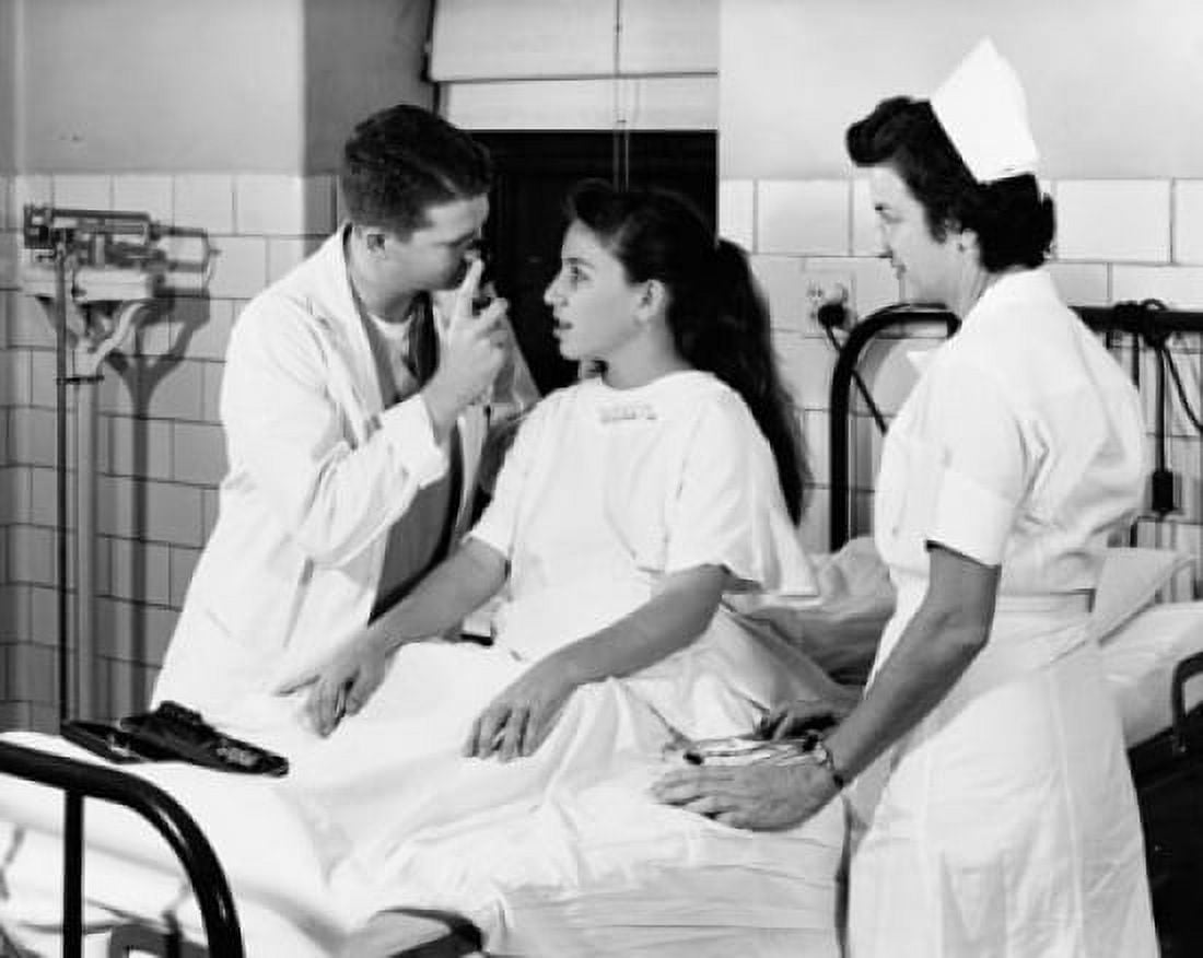 Male doctor examining the eyes of a patient Canvas Art - (18 x 24)