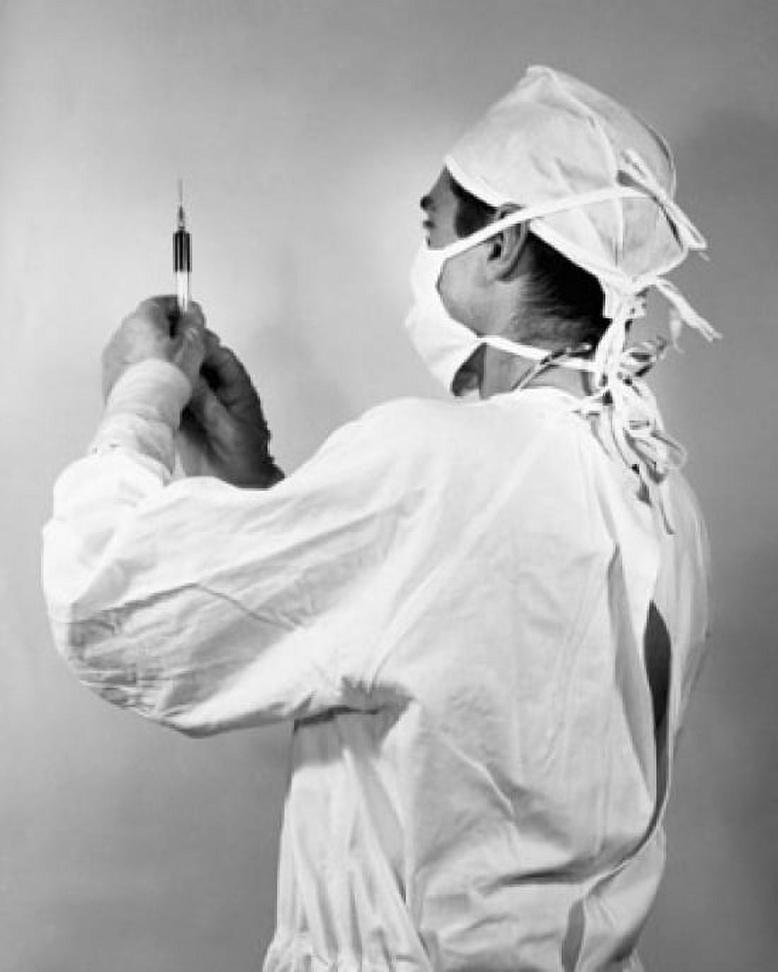 Male doctor holding a syringe Canvas Art - (24 x 36)
