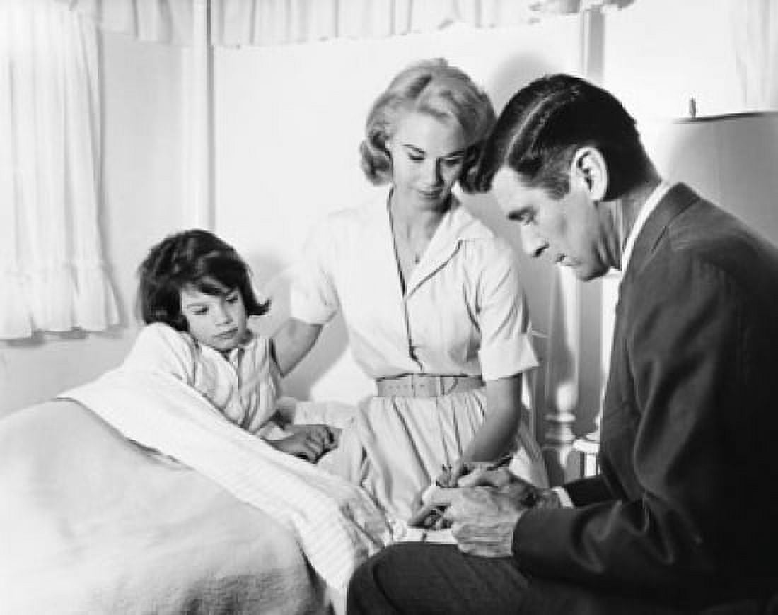 Male doctor writing a prescription for a female patient Canvas Art - (18 x 24)