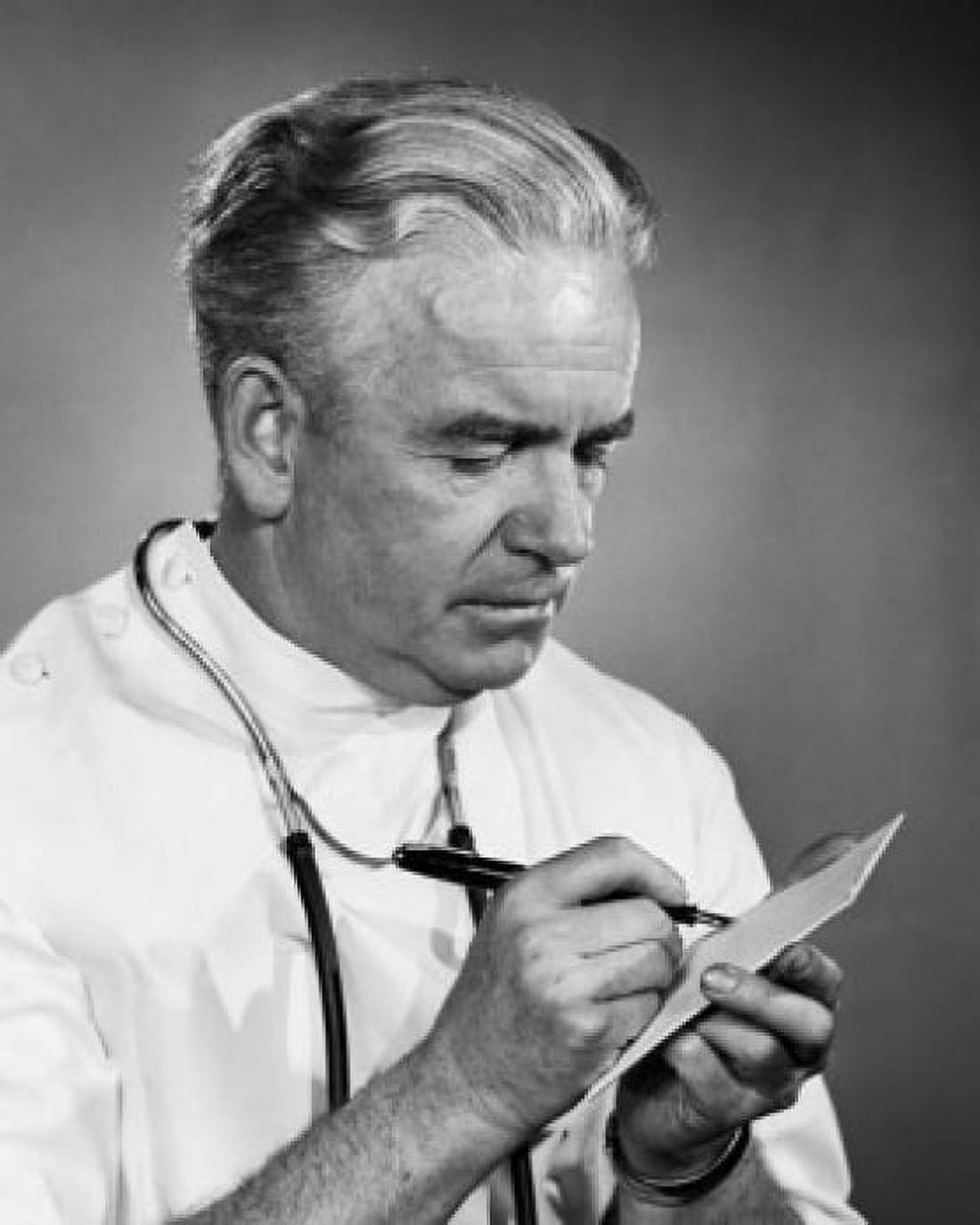 Male doctor writing a prescription on a notepad Canvas Art - (18 x 24)