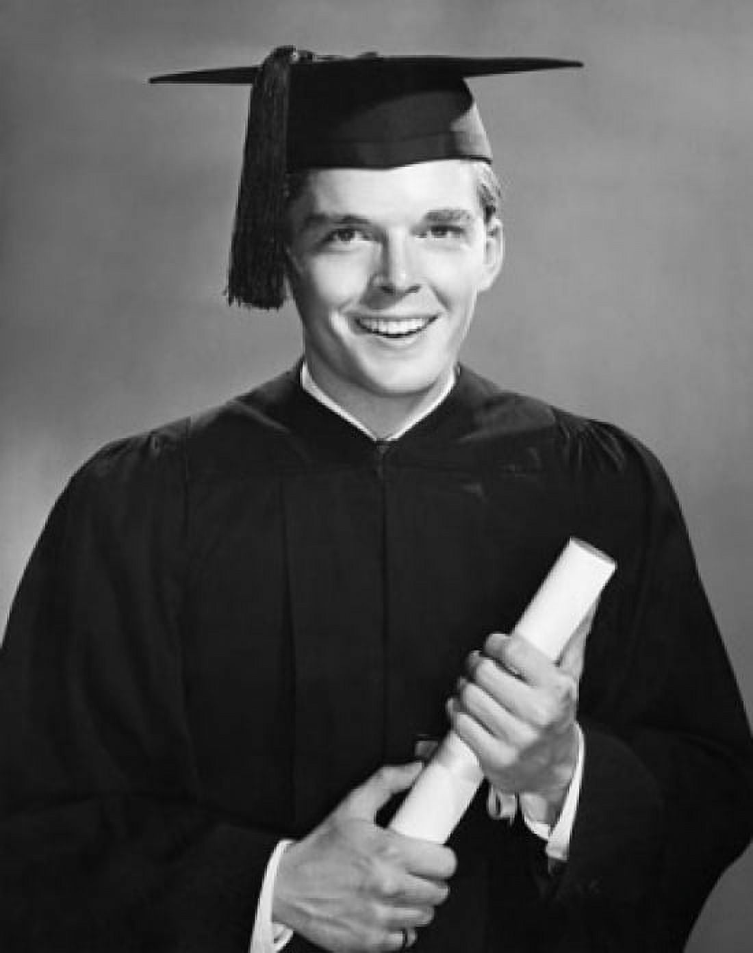 Male graduate holding a diploma and smiling Canvas Art - (18 x 24)