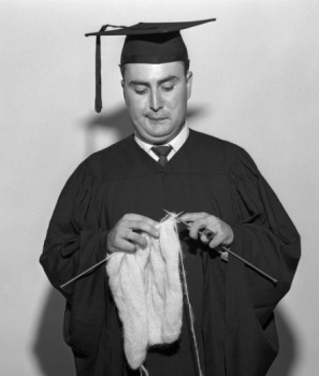 Male graduate student knitting Canvas Art - (24 x 36)