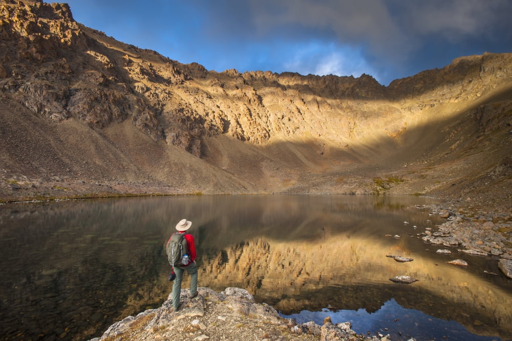 Male hiker enjoying the view of Hidden Lake Chugach State Park Southcentral Alaska Canvas Art - Michael Jones Design Pics (19 x 12)