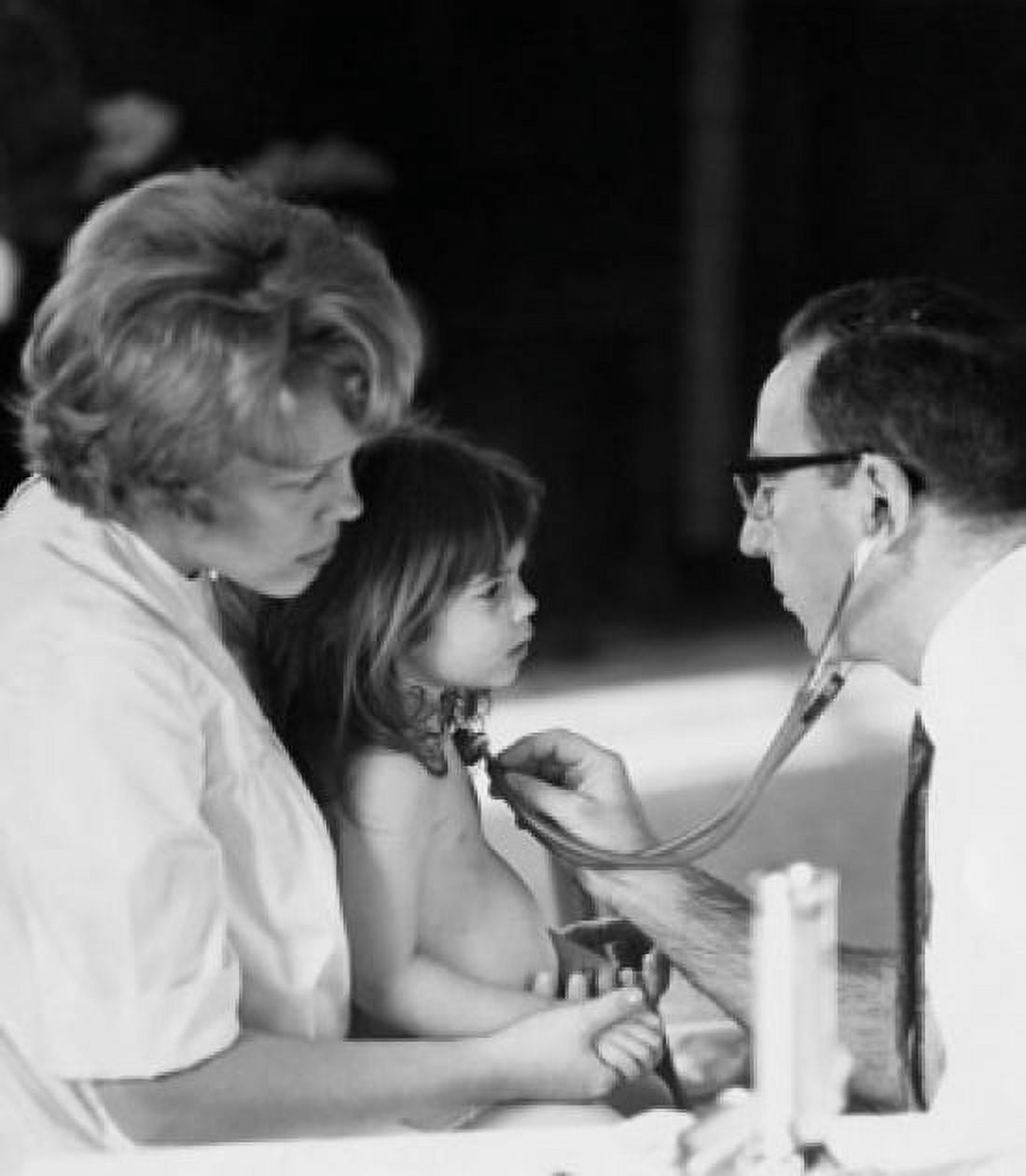 Male pediatrician examining a girl with a stethoscope Canvas Art - (24 x 36)