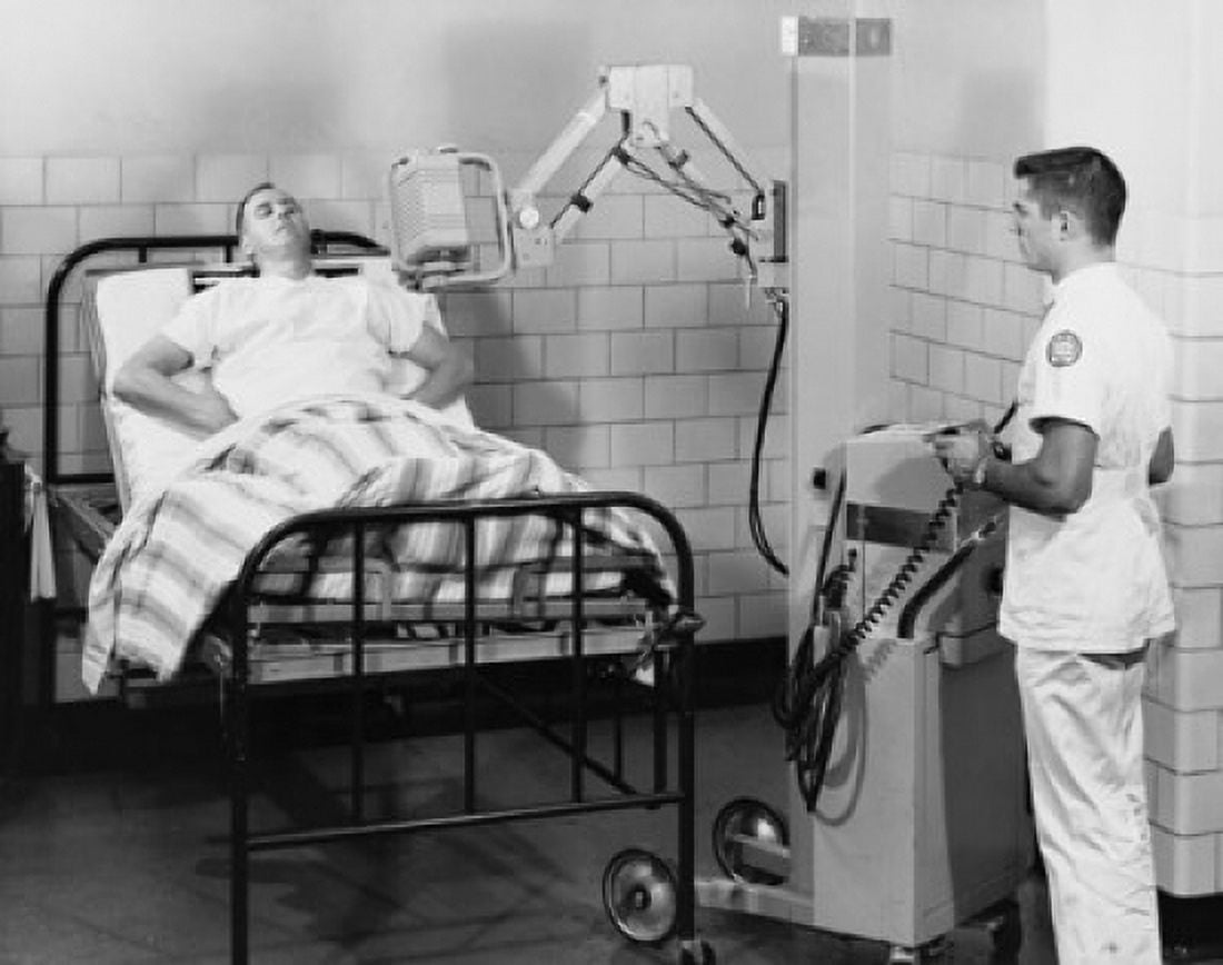 Male radiologist taking an x-ray of a patient Canvas Art - (18 x 24)