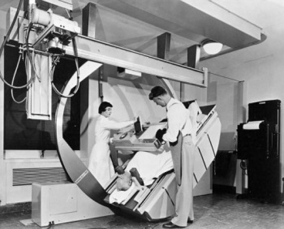 Male radiologist with a female radiologist taking an x-ray of a patient Canvas Art - (24 x 36)