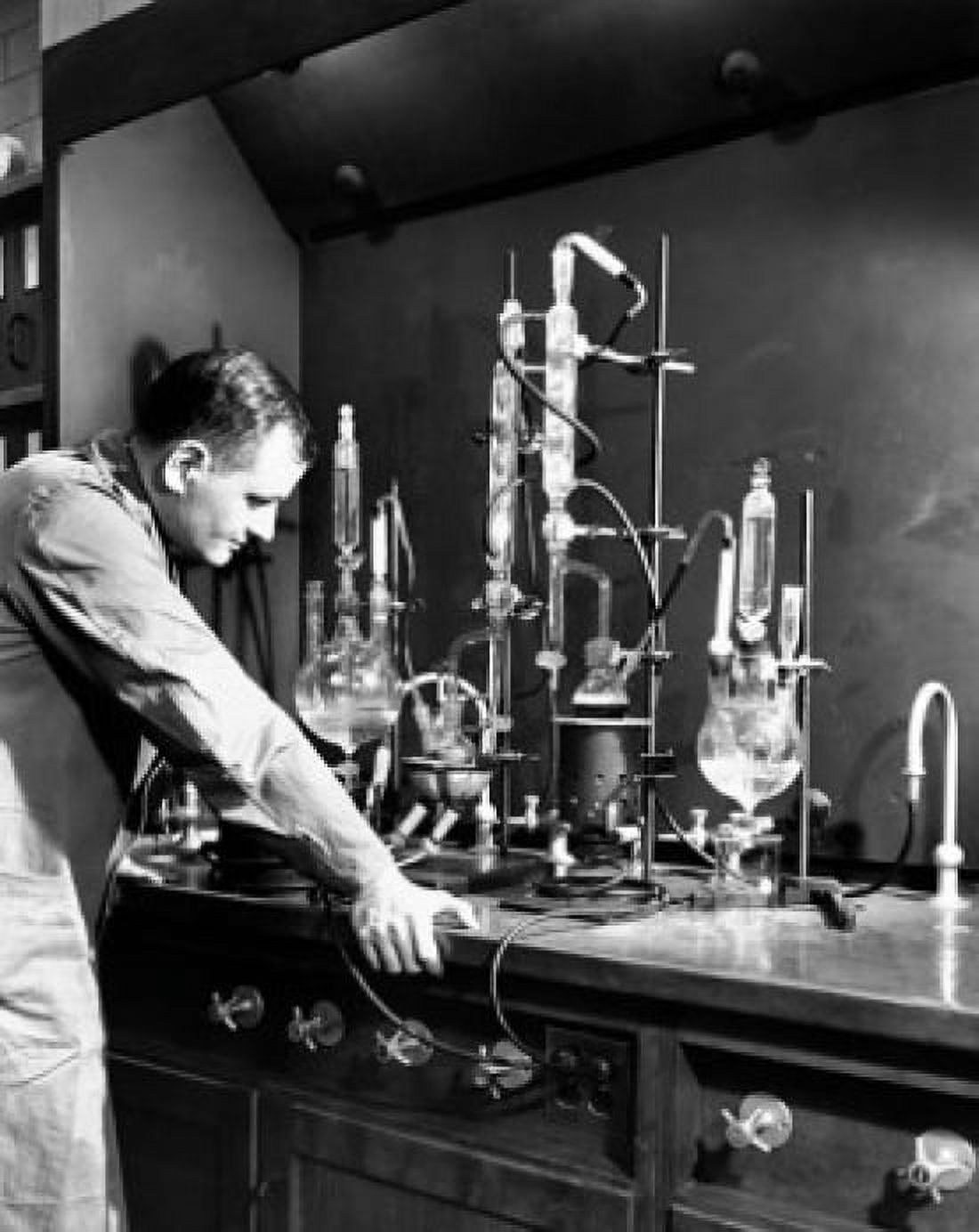 Male scientist doing a scientific experiment in a laboratory Canvas Art - (24 x 36)