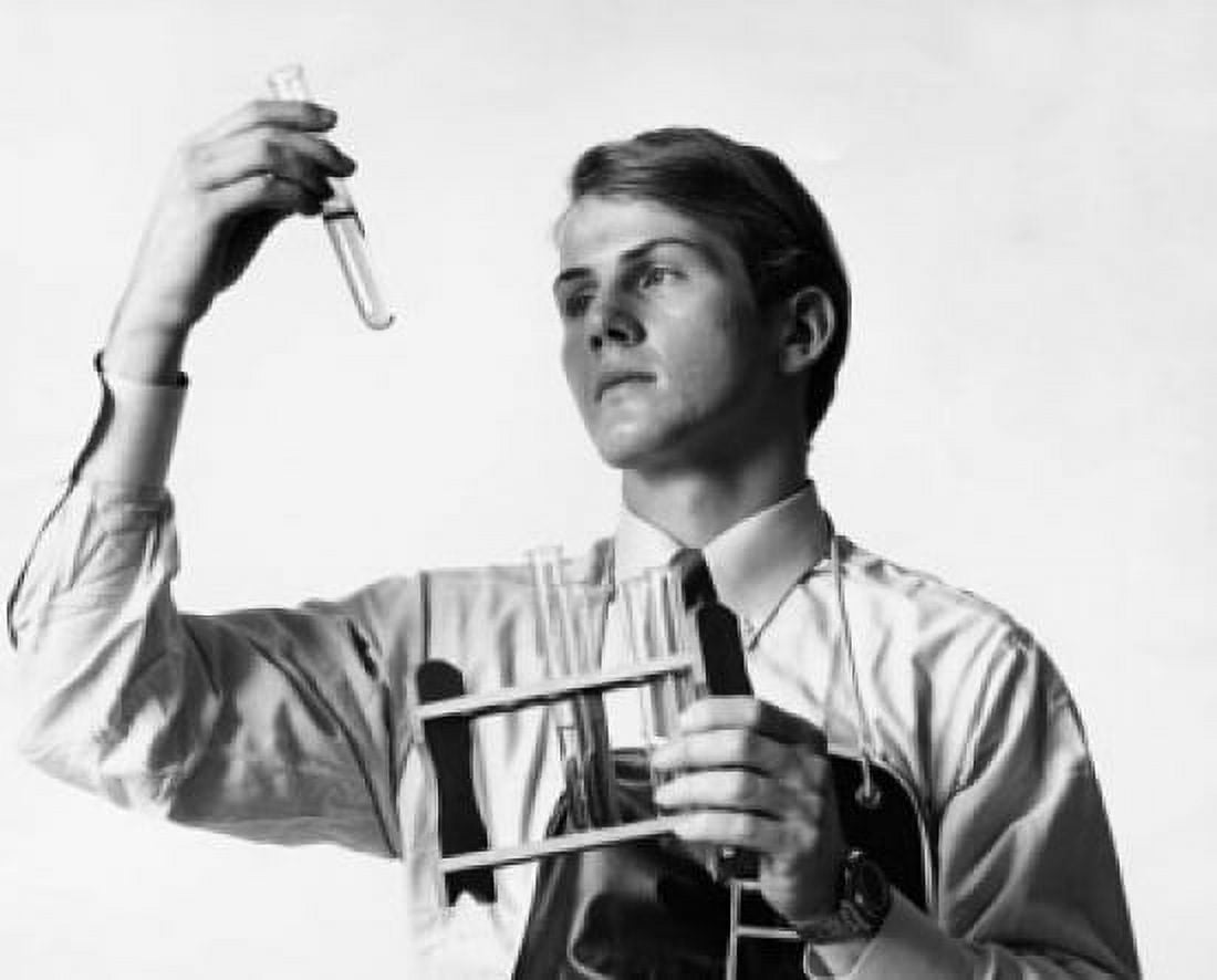 Male scientist examining a chemical in a test tube Canvas Art - (18 x 24)