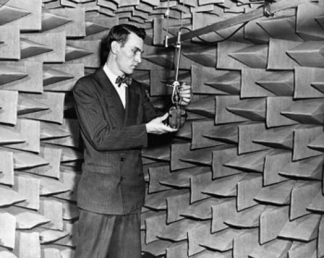Male scientist examining a microphone in a laboratory Canvas Art - (24 x 36)