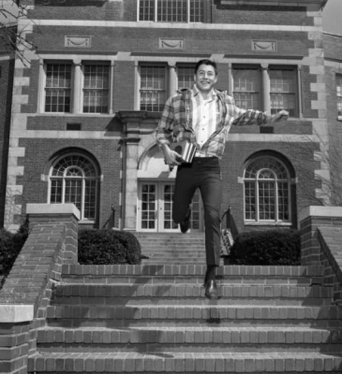 Male student jumping down steps outside university Canvas Art - (24 x 36)