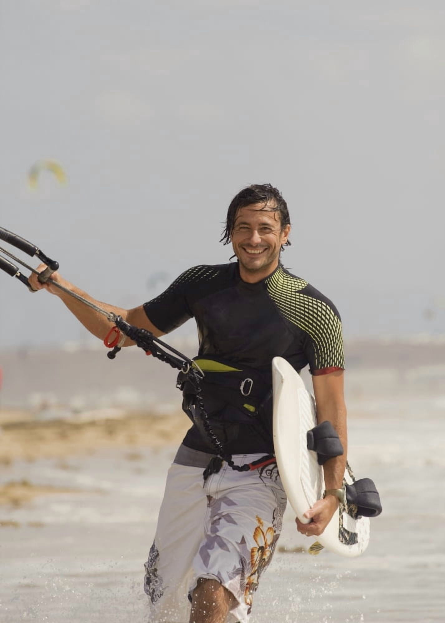 Man Carrying Kitesurfing Board Canvas Art - Ben Welsh Design Pics (12 x 17)