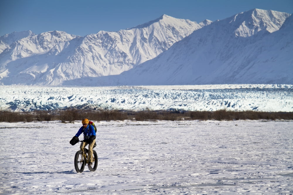 Man Fat Tire Mountain Biking On The Knik Glacier Chugach Mountains Southcentral Alaska Winter Canvas Art - Joe Stock Design Pics (34 x 22)