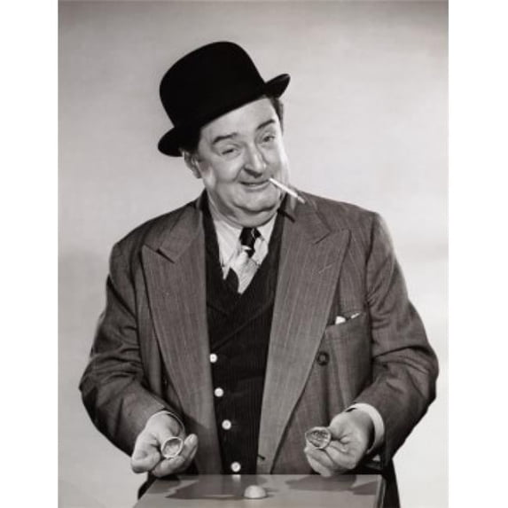 Man Holding Nutshells Poster Print - 18 x 24 in.