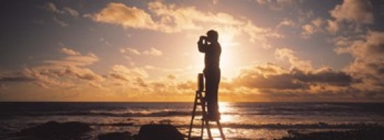 Man Looking Through Binoculars In Silhouette Canvas Art - Panoramic Images (36 x 13)