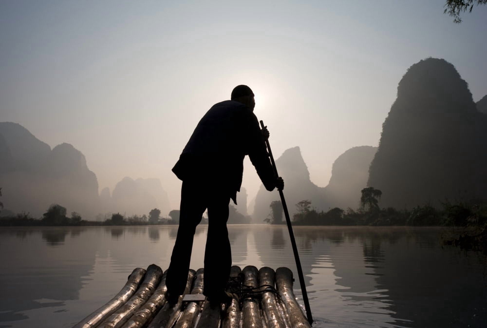 Man On Raft In Mountain Area Canvas Art - Keith Levit Design Pics (40 x 26)