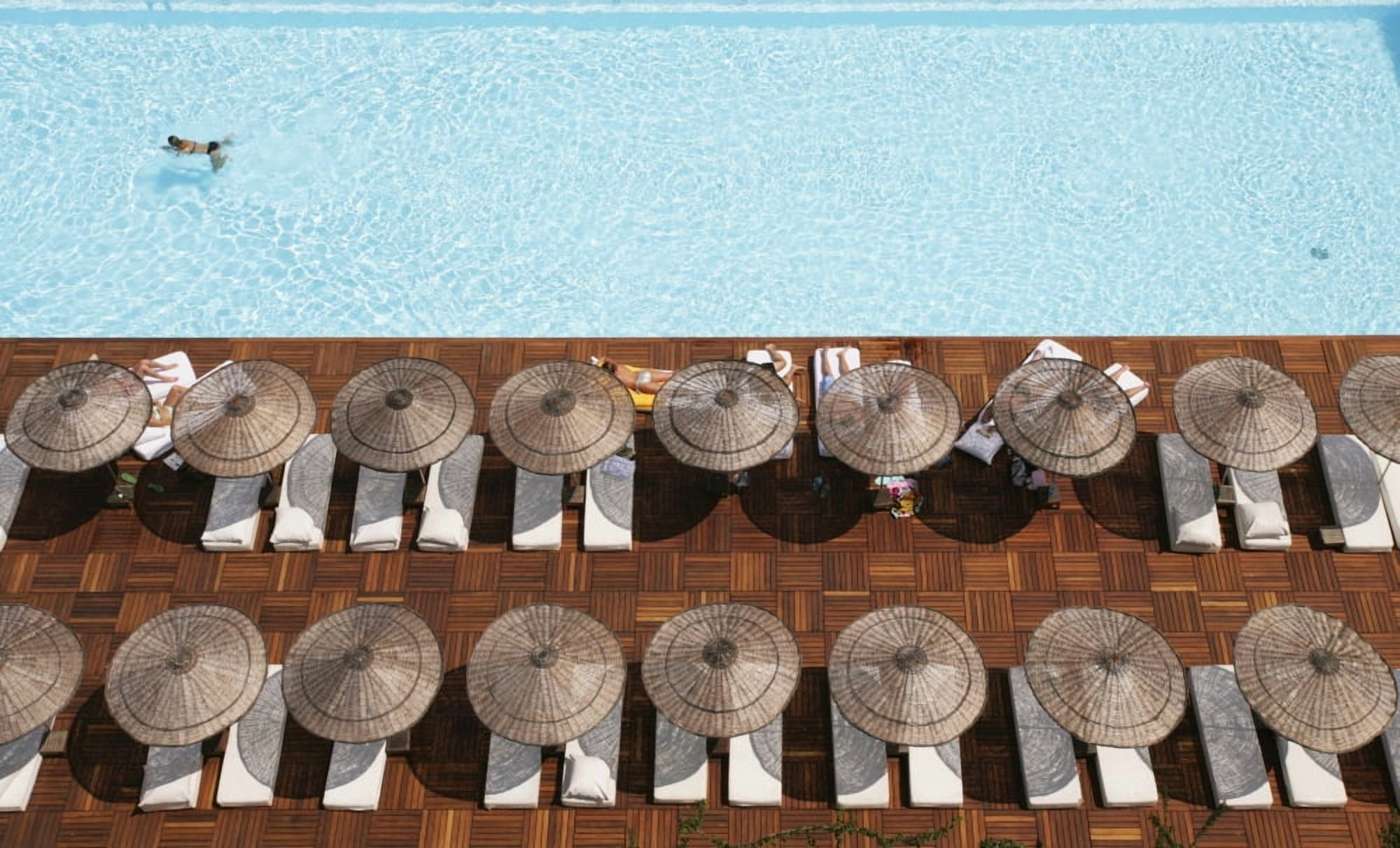Man Swimming In Pool By Sunloungers Aerial View Canvas Art - Chris Caldicott Design Pics (38 x 24)