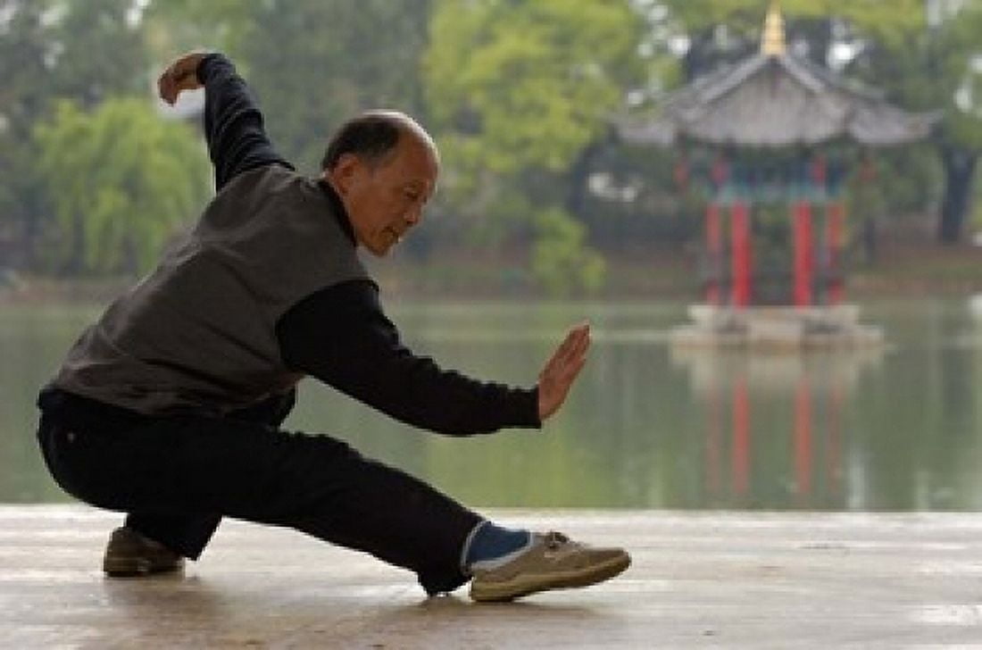 Man Doing Tai Chi Exercises at Black Dragon Pool with One-Cent Pavilion Lijiang Yunnan Province China Canvas Art - Pete Oxford DanitaDelimont (38 x 26)