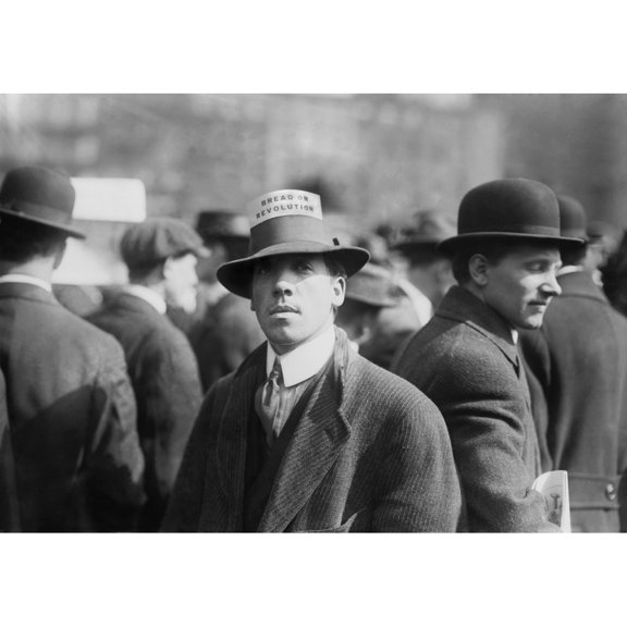 Man Wearing A Industrial Workers Of The World Hat Card Reading 'Bread Or Revolution' In A Rally At New York City'S Union