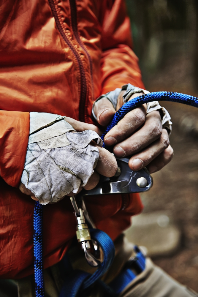 Man adjusting rock climbing equipment in the Adirondacks New York USA Canvas Art - Roderick Chen Design Pics (24 x 38)