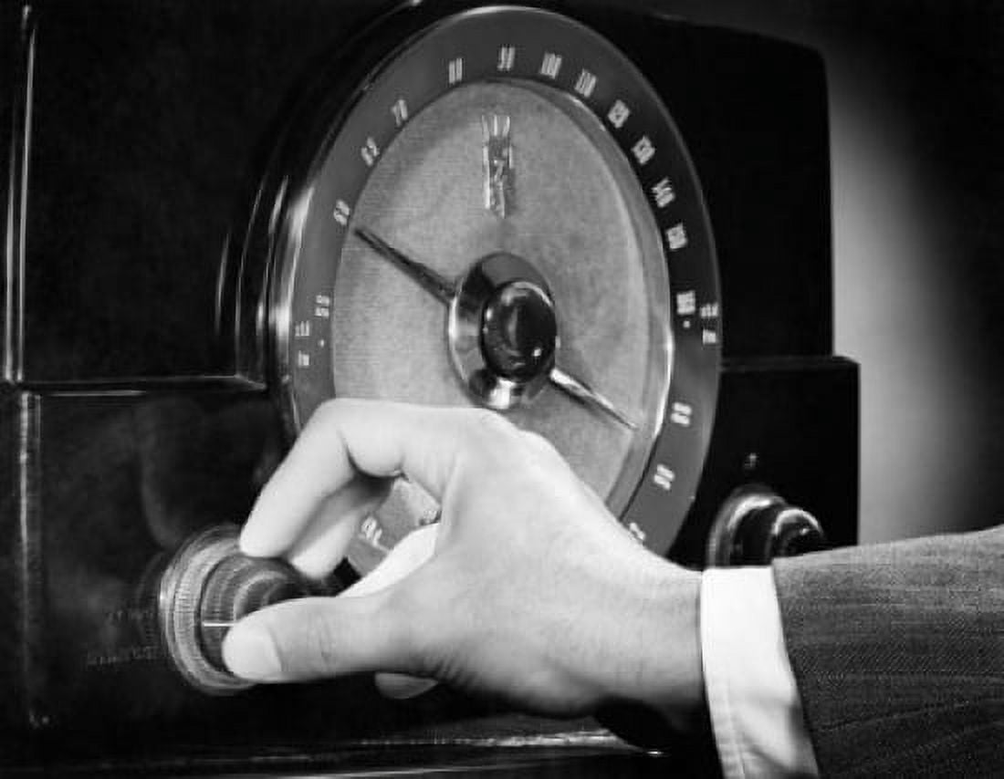 Man adjusting the knob of a radio Canvas Art - (18 x 24)
