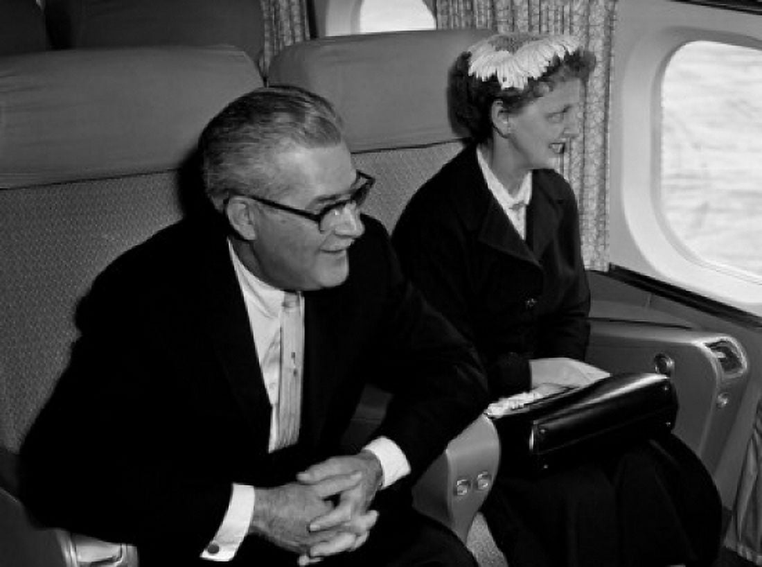 Man and woman traveling by plane Canvas Art - (24 x 36)