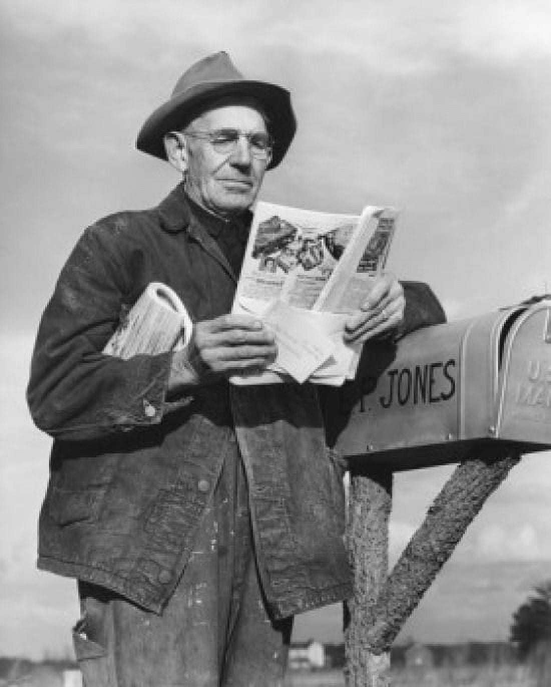 Man checking mailbox and reading magazine Canvas Art - (18 x 24)
