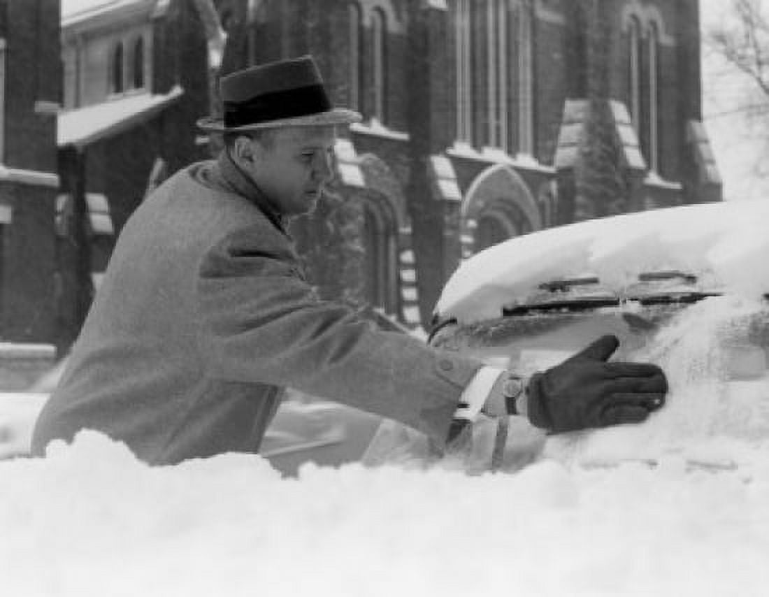 Man cleaning car of snow Canvas Art - (24 x 36)