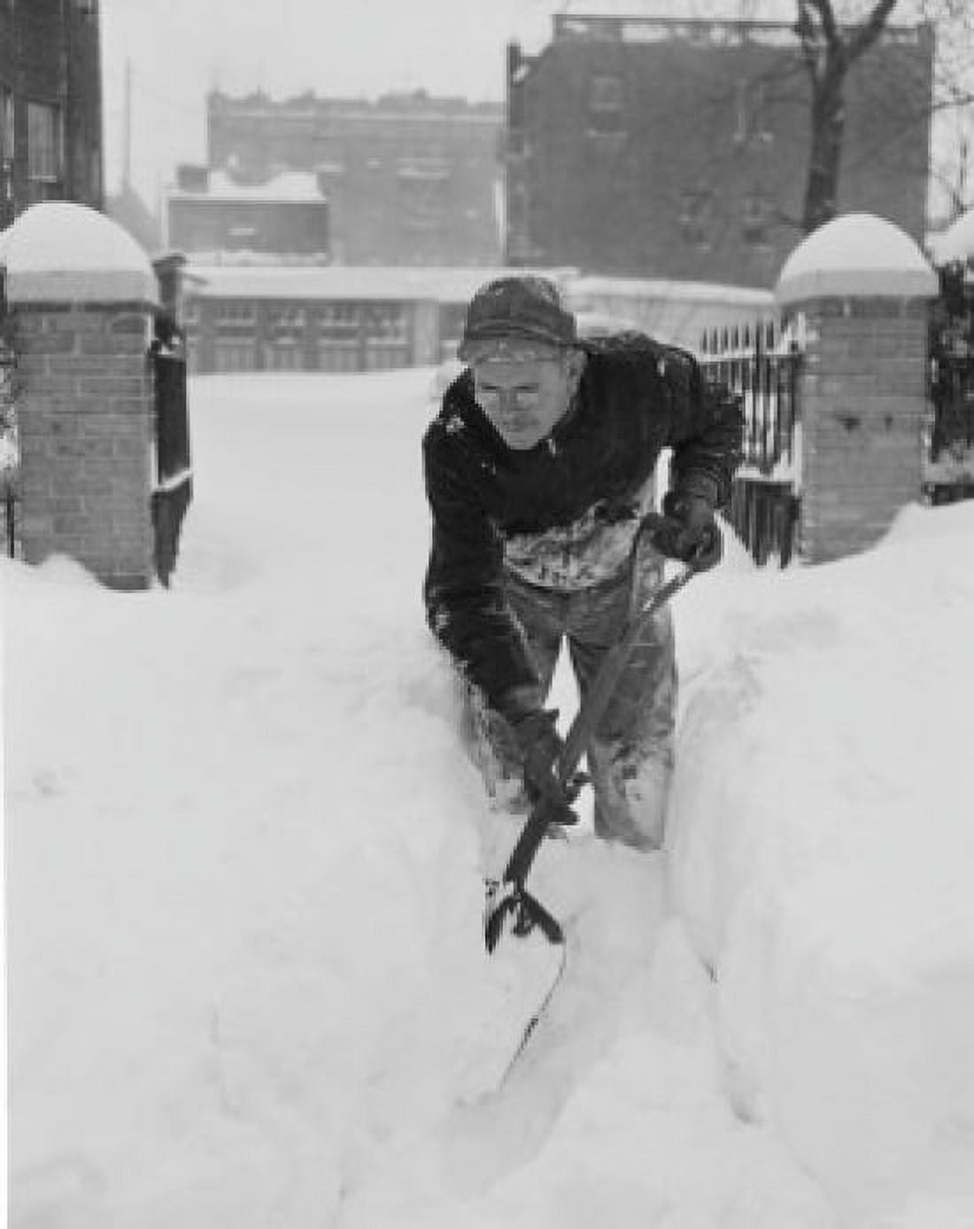 Man digging snow from garden path Canvas Art - (24 x 36)
