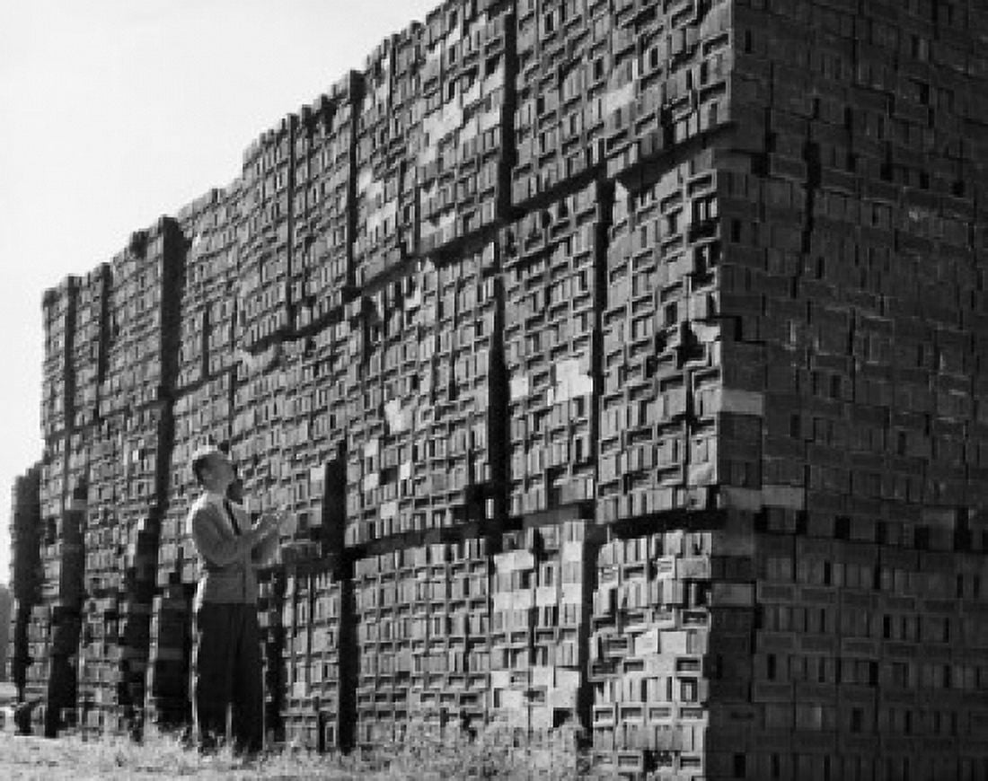Man examining bricks in a brickyard Canvas Art -  (24 x 36)