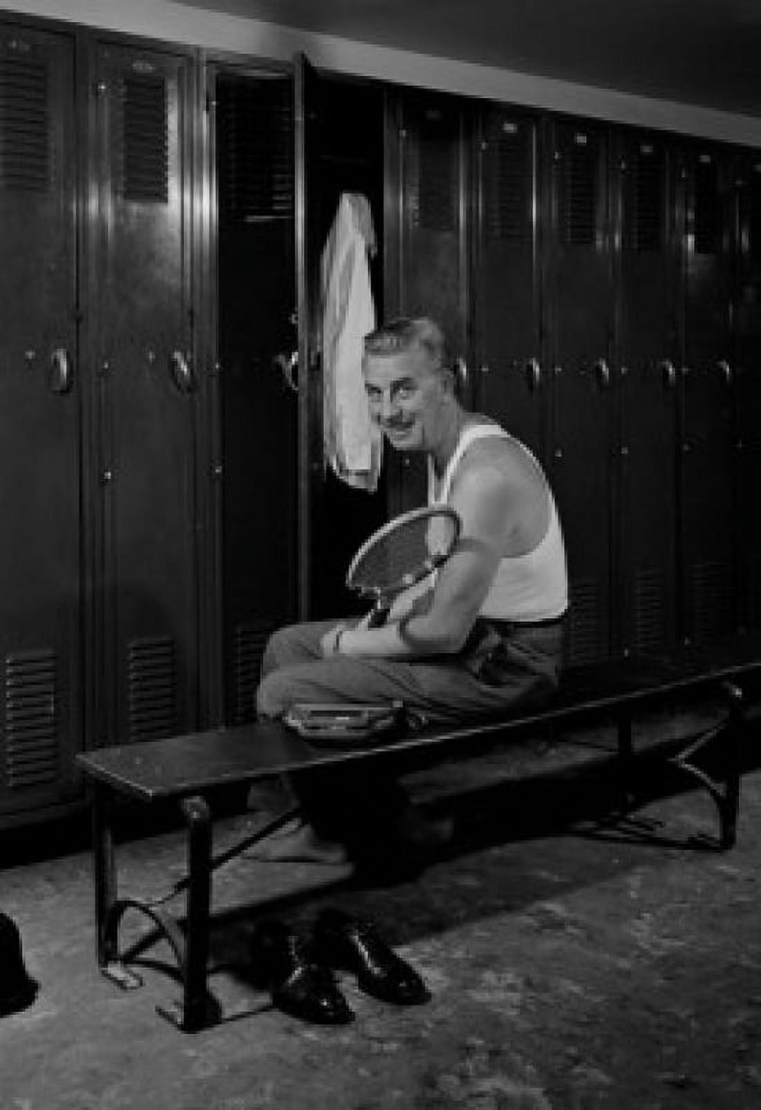 Man getting dressed in locker room Canvas Art - (24 x 36)