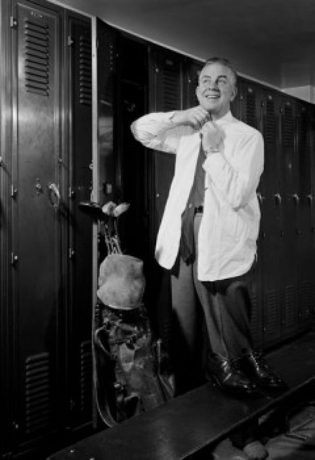 Man getting dressed in locker room Canvas Art - (24 x 36)