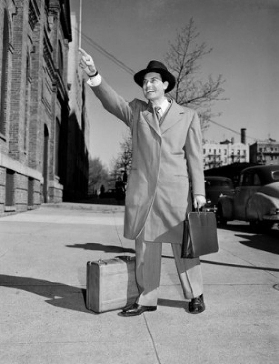 Man hailing for taxi in street Canvas Art - (18 x 24)