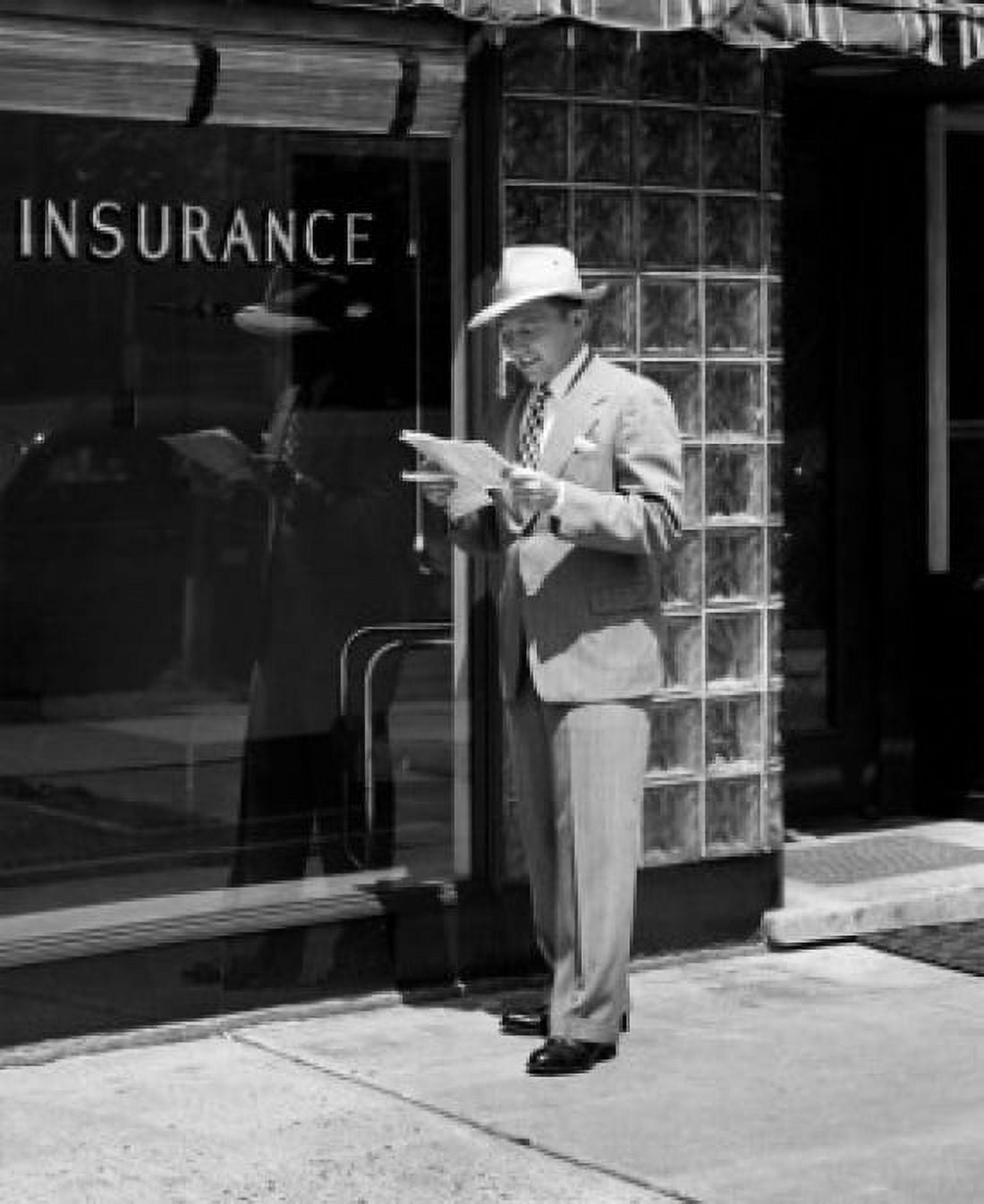 Man holding documents standing in front of insurance company Canvas Art - (18 x 24)